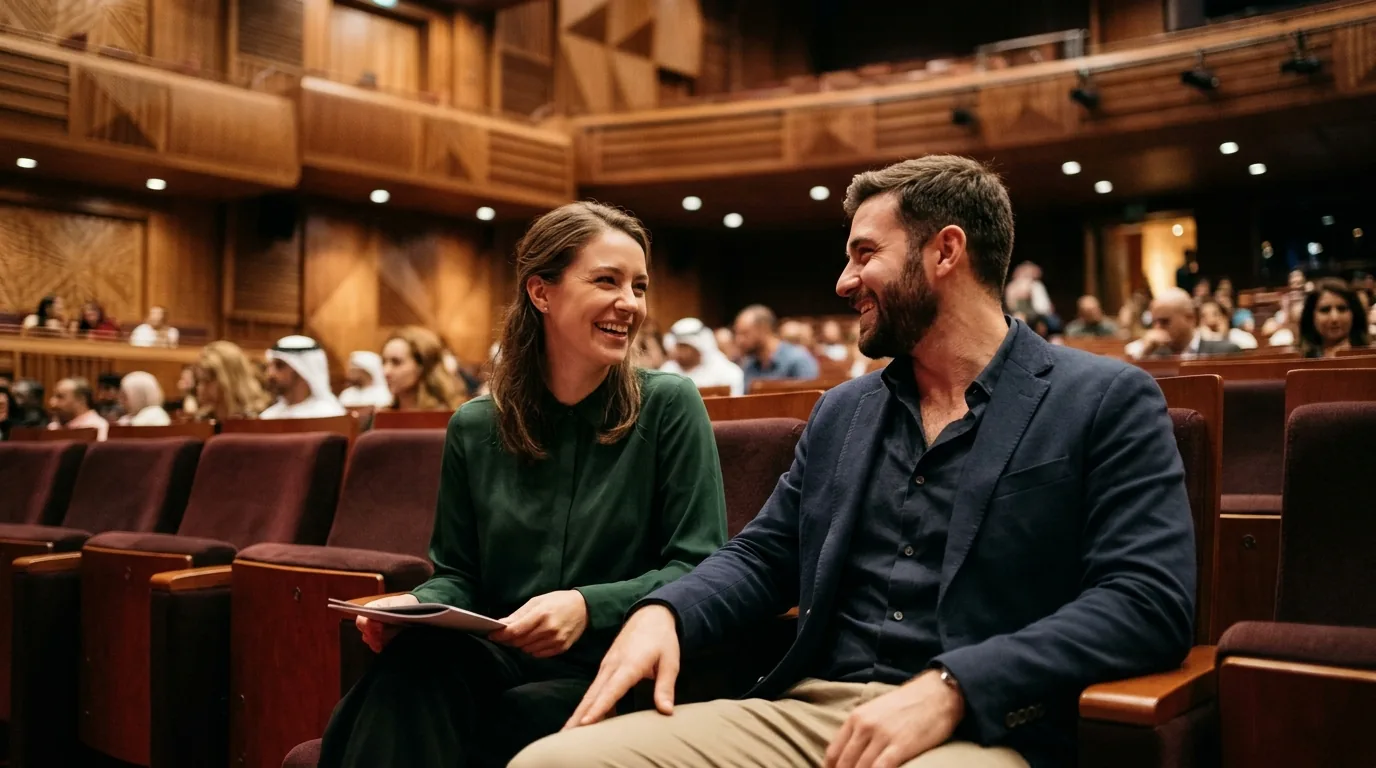 Couple seated in theater enjoying the ambiance before a comedy performance