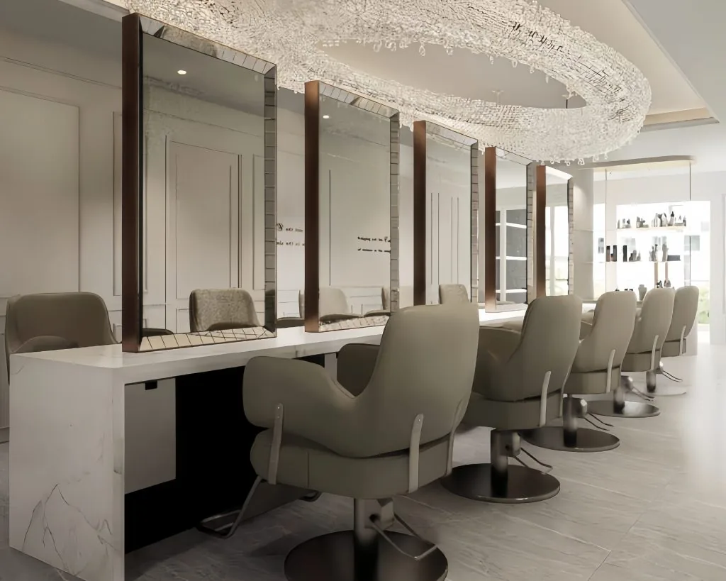 Hair salon interior with multiple styling stations, mirrored walls, and contemporary furnishings.