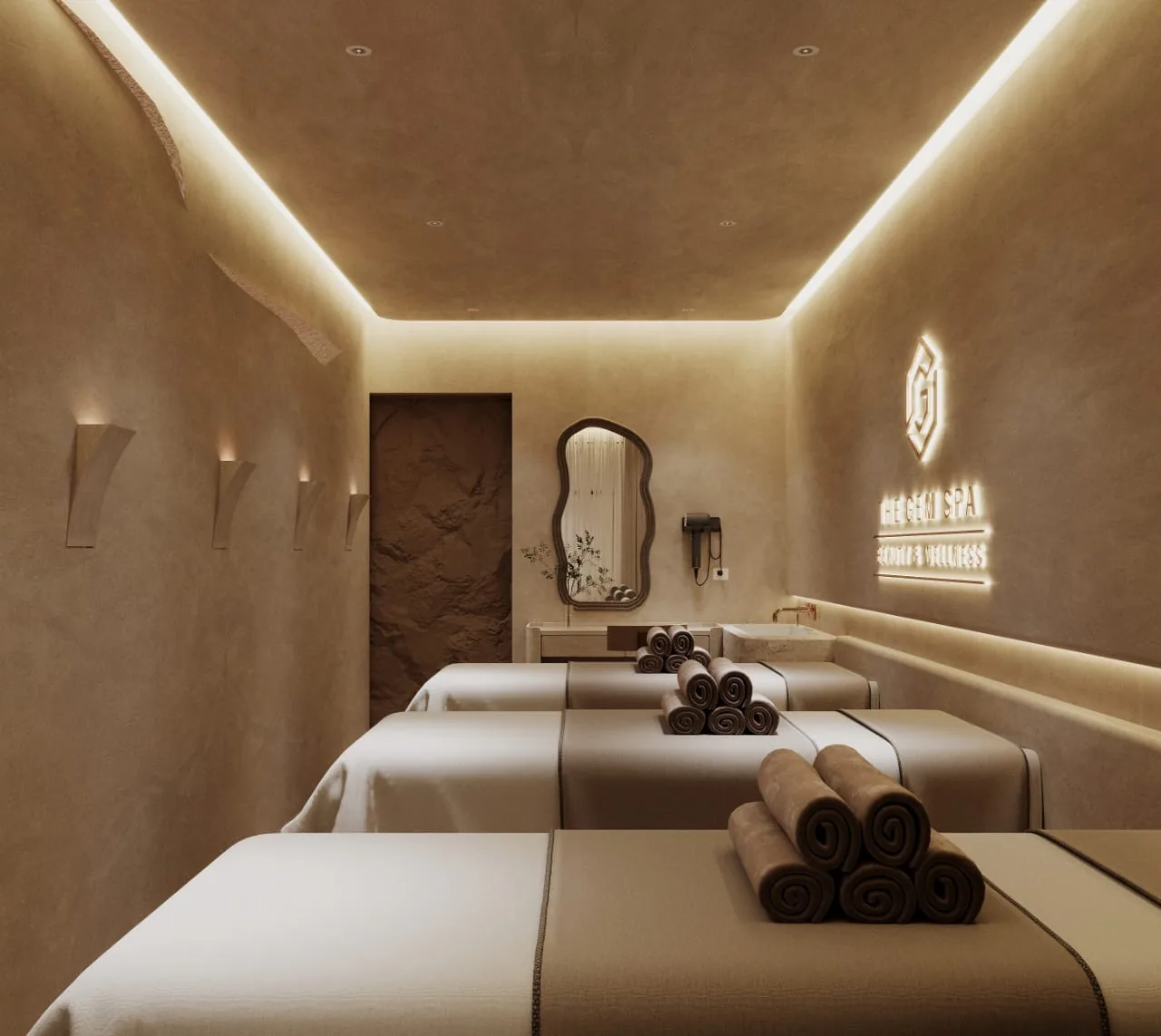 Spa treatment room with massage beds, warm lighting, and rolled towels on display