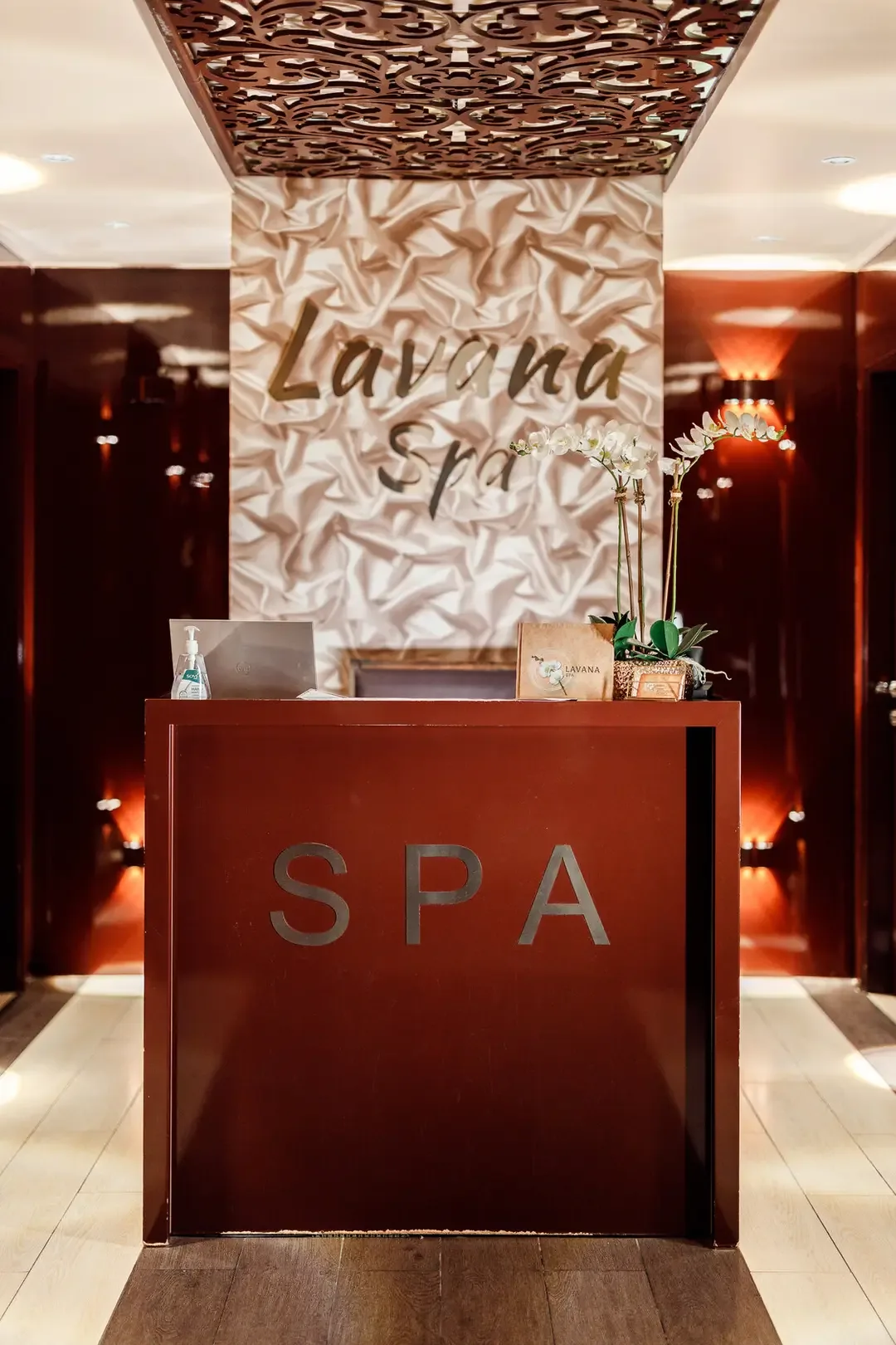 Lavana Spa reception desk with modern decor and warm lighting