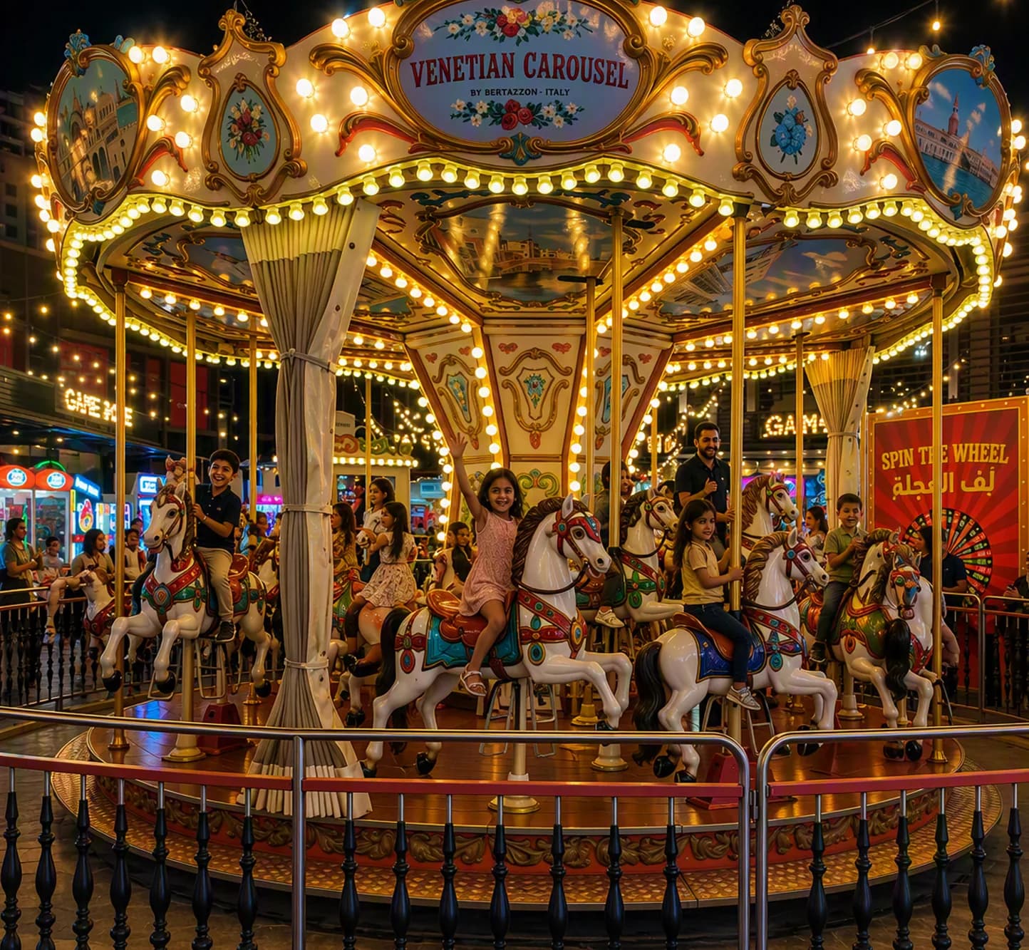 Illuminated Venetian carousel at night with ornate gold frame and carousel horses