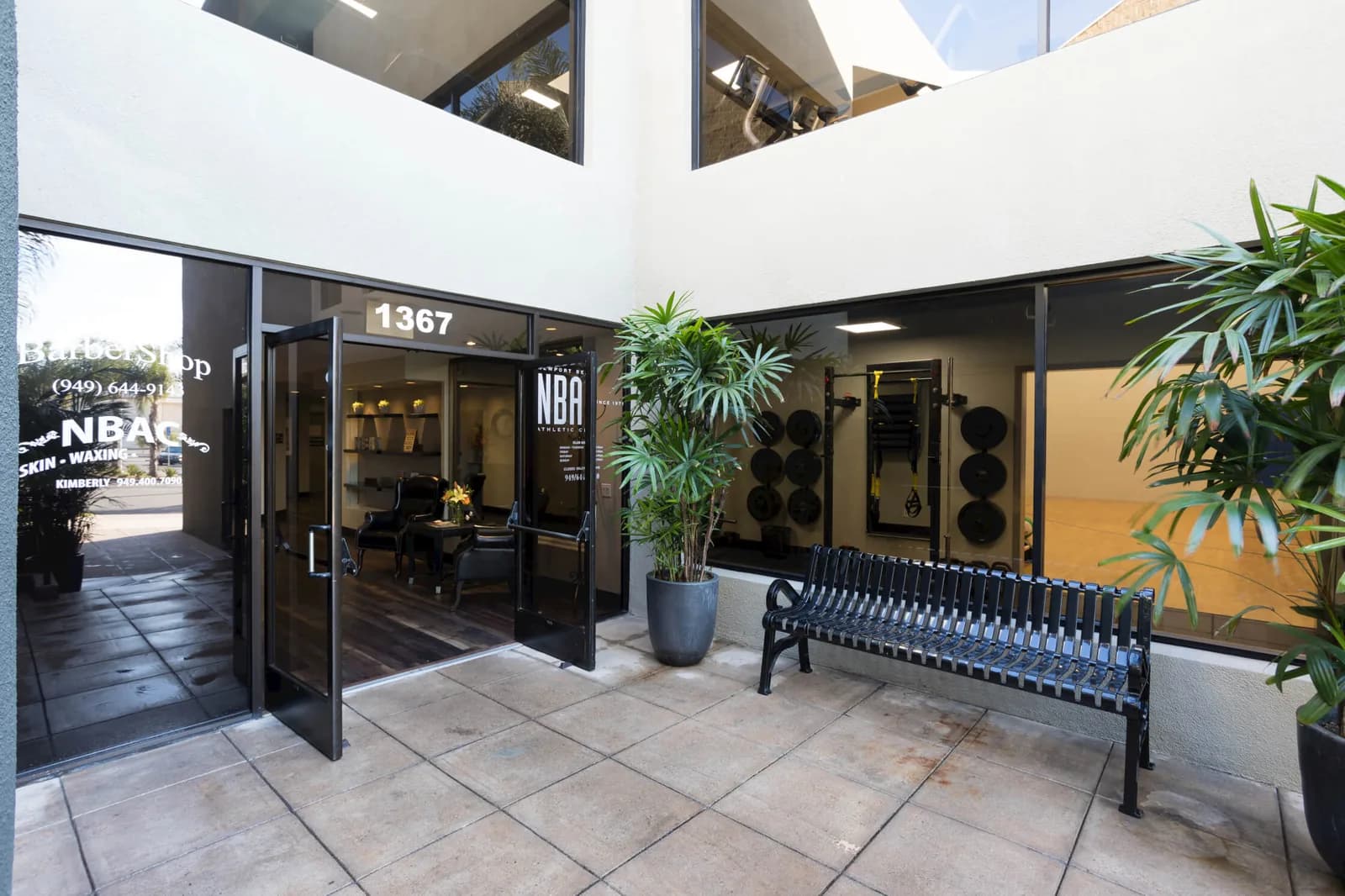 Newport Beach Athletic Club storefront with glass doors, windows, and modern architecture