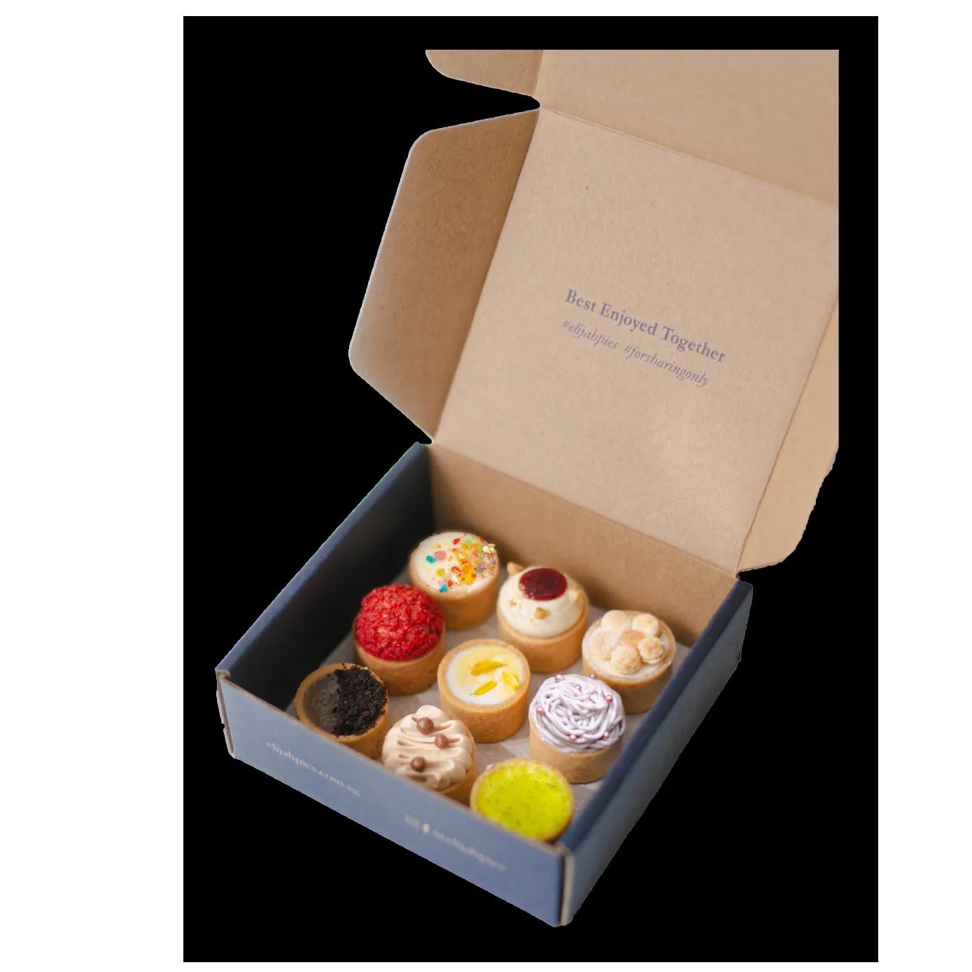Open box displaying nine colorful cupcakes with different toppings and frosting designs