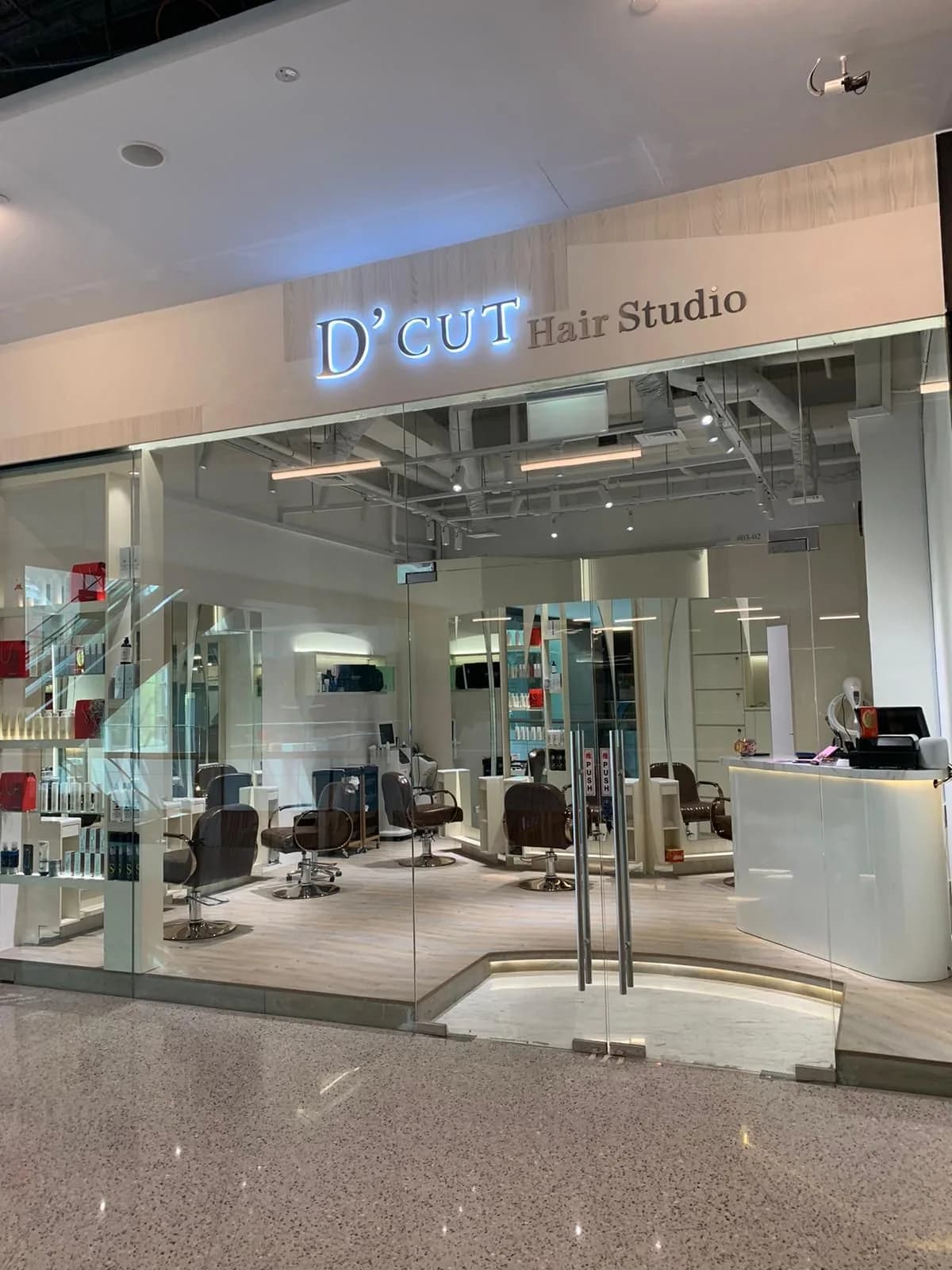 D'cut Hair Studio storefront with modern interior, styling stations and professional salon chairs