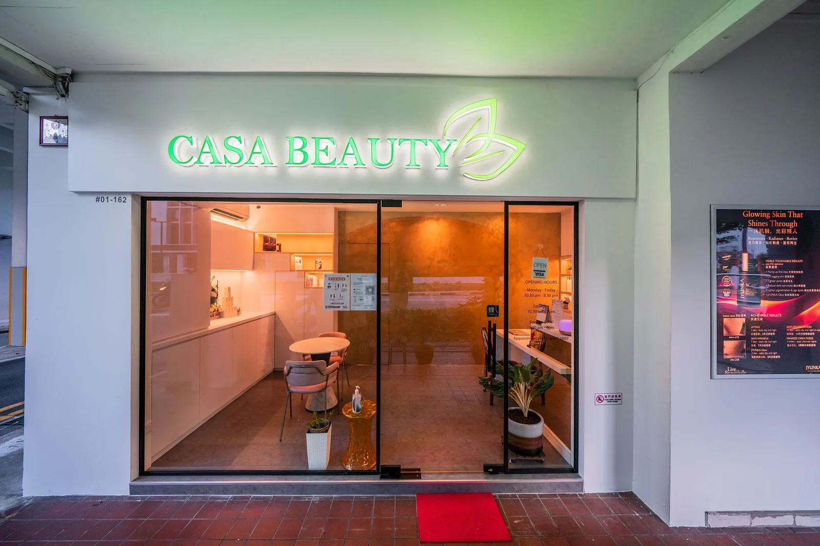 Casa Beauty storefront with neon signage and treatment room interior visible through windows