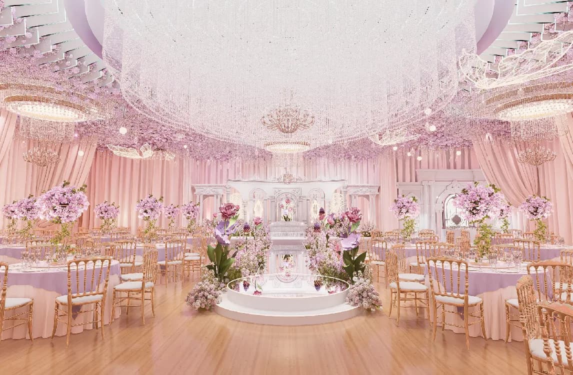 Pink and gold decorated wedding ballroom with floral centerpieces and dramatic ceiling draping