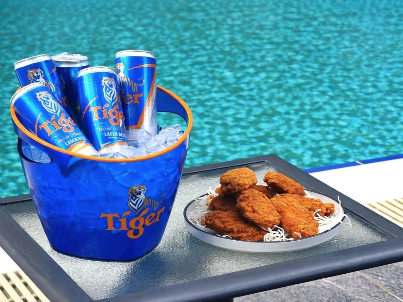 Tiger beer bucket and fried chicken appetizers by the pool