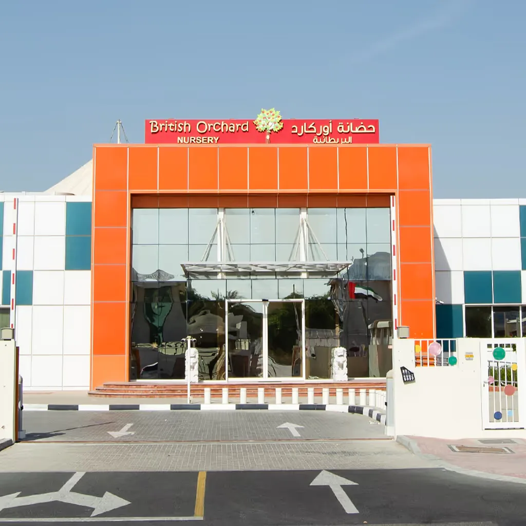 British Orchard Nursery storefront with orange facade and glass entrance doors