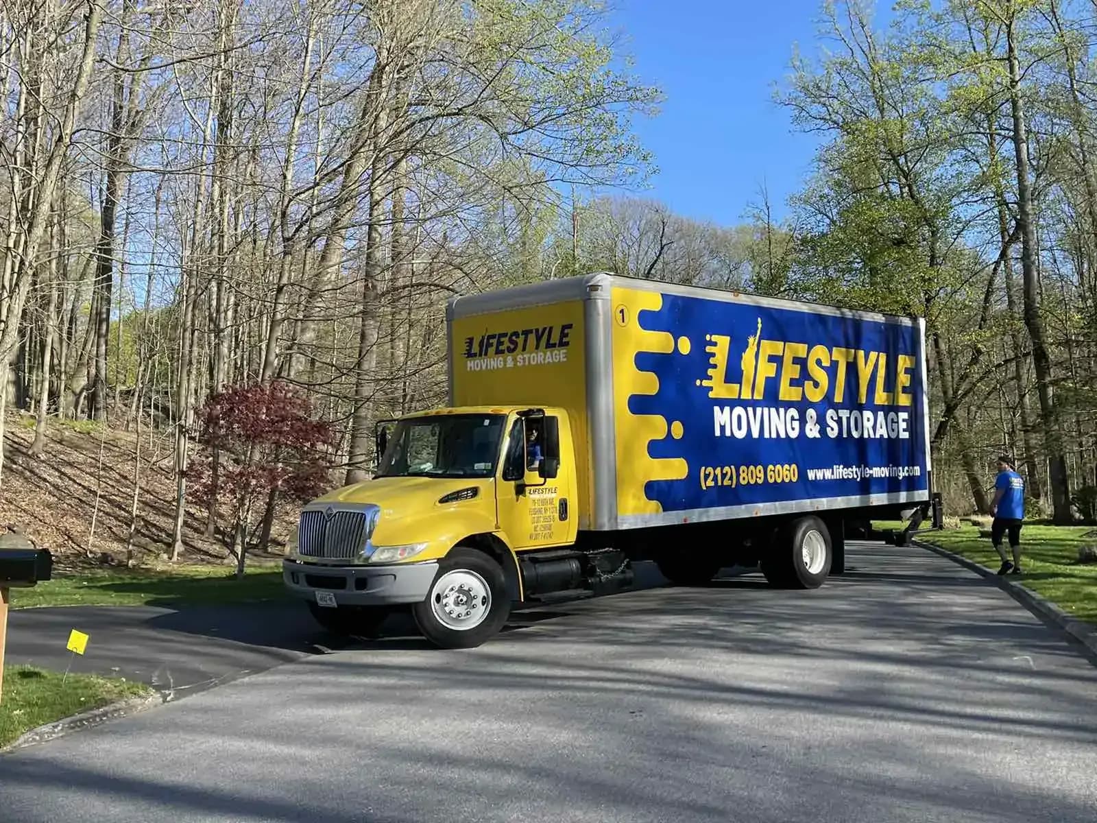 Lifestyle Moving & Storage moving truck on a residential driveway.