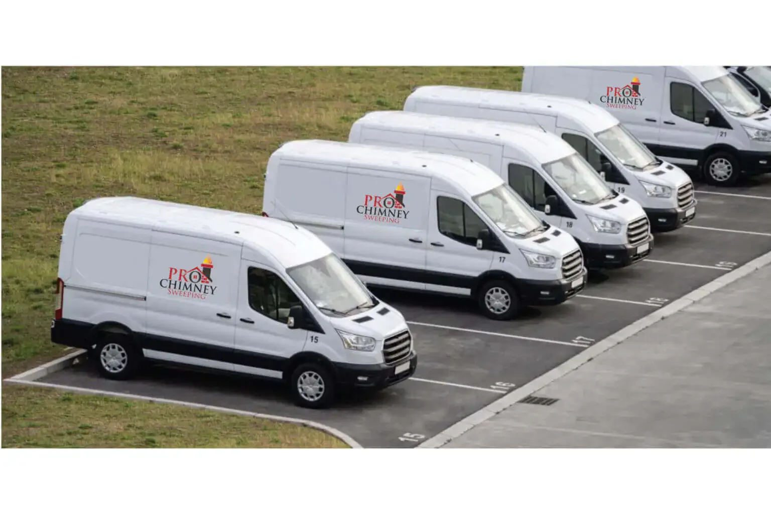 Four white Pro Chimney Sweeping service vans lined up in a parking lot