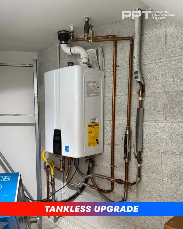 Installed tankless water heater with copper pipes and fittings on basement wall
