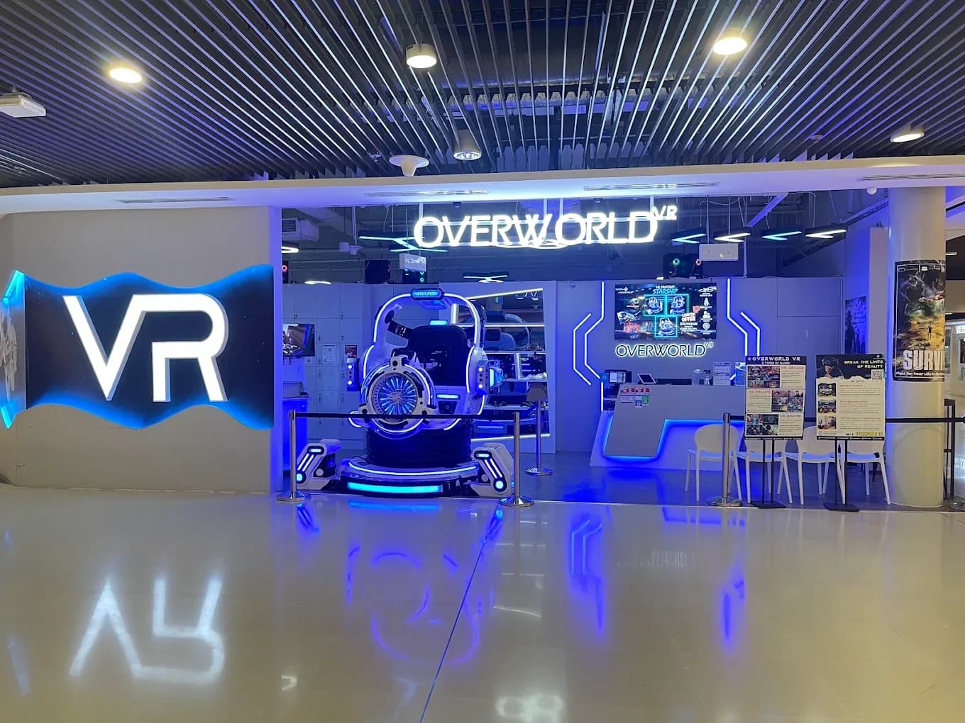 VR arcade storefront with neon VR sign, blue-lit gaming pod, and Overworld branding