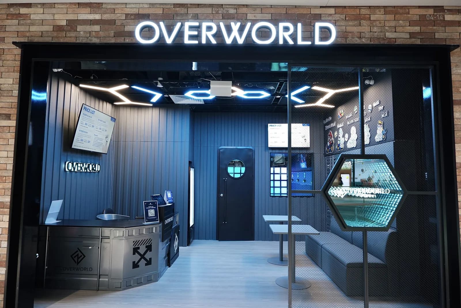 Overworld Lava storefront with neon signage, blue interior, and gaming displays at Orchard Central shopping mall.